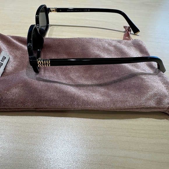 Miu Miu Black Sunglasses with Gold Accents - Picture 3 of 4